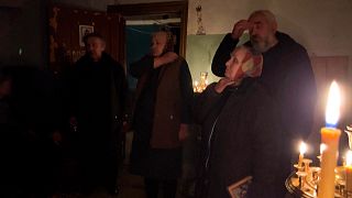 Priest holds mass in basement of Ukraine church amid sounds of Russian shelling