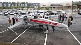People look over Dr. Akaki Lekiachilli's near life-like replica of an X-Wing Starfighter from Star Wars, which was designed by Cantwell.