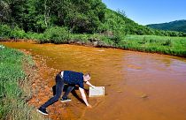 River in Slovakia turns orange as scientists warn of an ecological disaster.