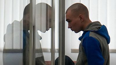 Russian Sgt. Vadim Shishimarin stands in court during a hearing in Kyiv, Ukraine, Thursday, May 19, 2022.