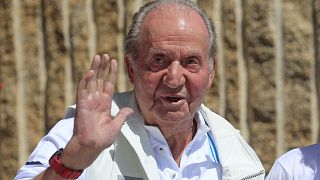 uan Carlos waves before a reception at a nautical club in Sanxenxo on Friday.