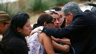 The Archbishop of San Antonio, Gustavo Garcia Seller, comforts families following a deadly school shooting at Robb Elementary School in Uvalde, Texas. Tuesday, May 24, 2022.