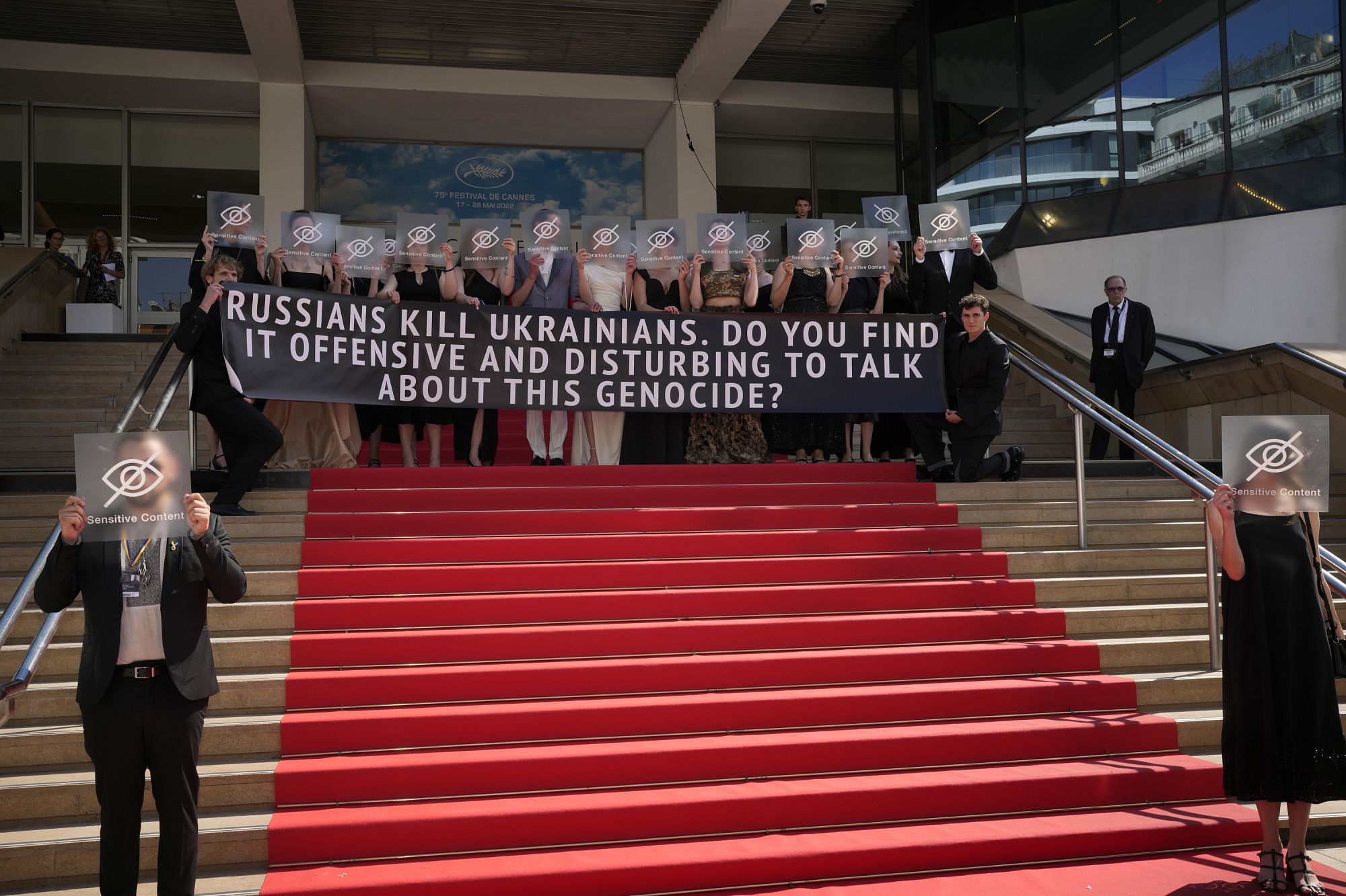 Topless Woman Removed From Cannes Red Carpet After Pro-Ukraine