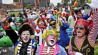 Clowns cheers during Peruvian Clown Day in Lima.