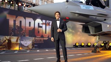Tom Cruise poses for the media during the 'Top Gun Maverick' UK premiere at a central London cinema