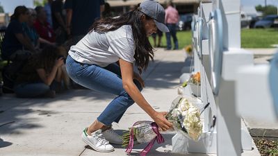 Meghan Markle, Duchess of Sussex, visits a memorial site, Thursday, May 26, 2022, honoring the victims killed in Tuesday's elementary school shooting in Uvalde, Texas,