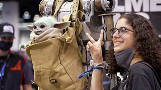 A fan taking photo during star wars convention.