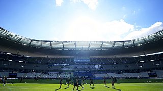 Liverpool players exercise during a training session at the Stade de France