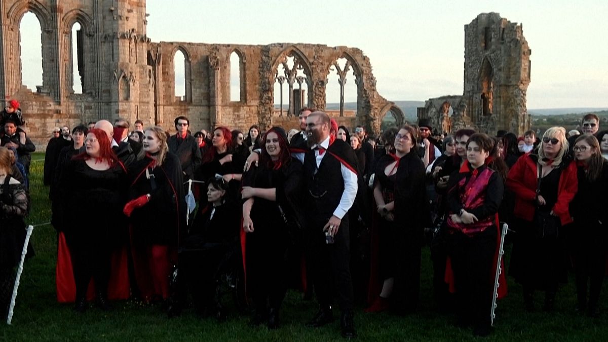 People dressed as vampires try to break the record for the number of vampires.