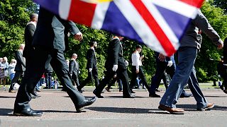 Members of the Orange Order and bands parade from Parliament Buildings, Stormont, in Belfast on 28 May 2022