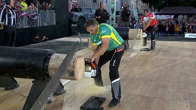 Brad de Losa (3rd place in the competition) cutting logs.