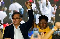 Presidential candidate Gustavo Petro, left, and his running mate Francia Marquez stand before supporters on election night in Bogota, Colombia, Sunday, May 29, 2022. 