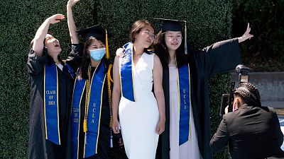 FILE  - UCLA graduates at Drake Stadium on the university campus, 10 June 2021