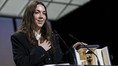 Director Gina Gammell accepts the Caméra d'or award for a first film for 'War Pony' during the awards ceremony of the 75th international film festival, Cannes, southern France