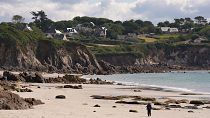 How are Breton communities preparing for coastal erosion?
