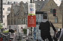 Campaign posters adorn the streets of Danish cities and towns