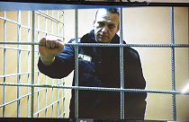 Navalny looks at a camera while speaking from a prison via a video link, during a court session in Petushki, Russia, Monday, Jan. 17, 2022. 