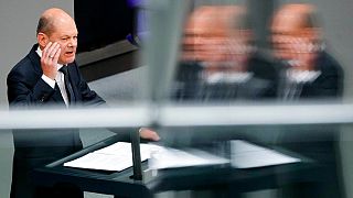 German Chancellor Olaf Scholz delivers his speech during a session of the German parliament Bundestag at the Reichstag building in Berlin, Germany, Wednesday, June 1, 2022. 