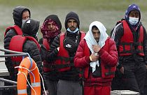 A group of people thought to be migrants are brought in to Dover, Kent, following a small boat incident in the Channel, England, Monday May 23, 2022.