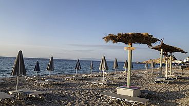 Empty sunbeds stand in the seaside village of Kokkari on the Greek island of Samos, on Tuesday, June 8, 2021. 