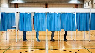 People vote at Rude Skov School in Birkeroed, Denmark, Wednesday June 1, 2022.