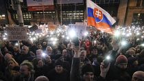 FILE- In this Friday, March 9, 2018, file picture demonstrators light the torches of their smartphones during an anti-government rally in Bratislava, Slovakia. 