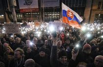 FILE- In this Friday, March 9, 2018, file picture demonstrators light the torches of their smartphones during an anti-government rally in Bratislava, Slovakia.