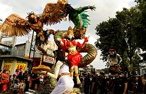 Giant effigies are held aloft during Nyepi, Balinese Hindu new year, in Bali, Indonesia