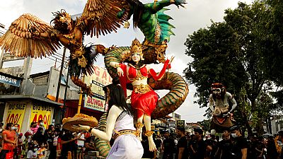 Giant effigies are held aloft during Nyepi, Balinese Hindu new year, in Bali, Indonesia