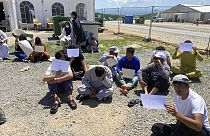 Afghans who fled the Taliban takeover of their country staging a protest at Camp Bondsteel in Kosovo, Wednesday, June 1, 2022. 