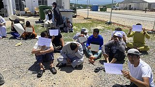 Afghans who fled the Taliban takeover of their country staging a protest at Camp Bondsteel in Kosovo, Wednesday, June 1, 2022.