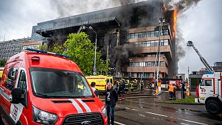 Russian Emergency Situation ministry's firefighters work at the scene of a fire that broke out at a business center in Moscow, Russia, Friday, June 3, 2022. 
