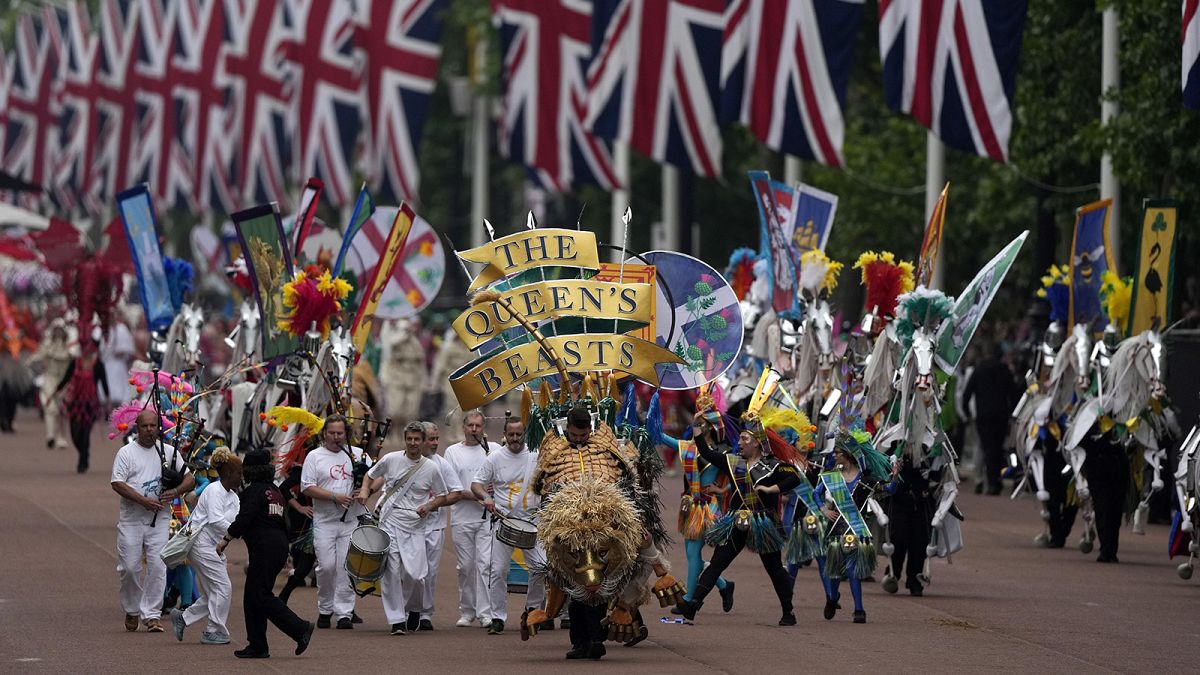 People parade during the Platinum Jubilee Pageant outside Buckingham Palace in London on 5 May 2022