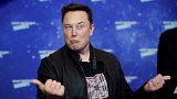 SpaceX owner and Tesla CEO Elon Musk arrives on the red carpet for the Axel Springer media award, in Berlin, Germany, Tuesday, Dec. 1, 2020.
