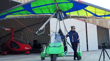 Reem Al Kuthairi with her microlight aircraft at Qatar Flying Club