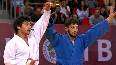 Girogi Shardalashvili raises the hand of Temur Nozadze after exhillerating final