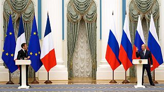 Russian President Vladimir Putin, right, gestures during a joint press conference with French President Emmanuel Macron in February 2022