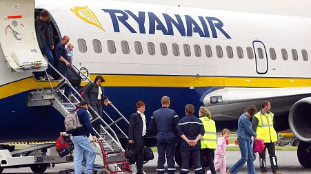 Ryanair passengers getting off a plane.