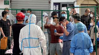 Shanghai residents in local lockdown confront hazmat-clad officials