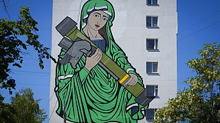 A mural depicts an image known as "Saint Javelina"- Virgin Mary cradling a US-made FGM-148 anti-tank weapon Javelin - on a living house wall in Kyiv, Ukraine, June 6, 2022.