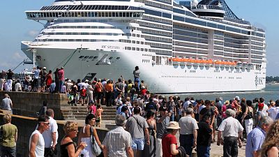 Passengers boarding a cruise ship.