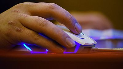 File photo: A man uses a computer in an internet cafe.