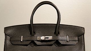 A counterfeit Hermes Berkin luxury handbag during a press preview of "Treasures on Trial: The Art and Science of Detecting Fakes" at the Winterthur Museum.