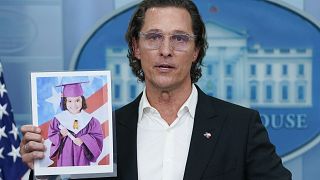 McConaughey holds a picture or Alithia Ramirez, 10, who was killed in the mass shooting at the Uvalde elementary school last month.