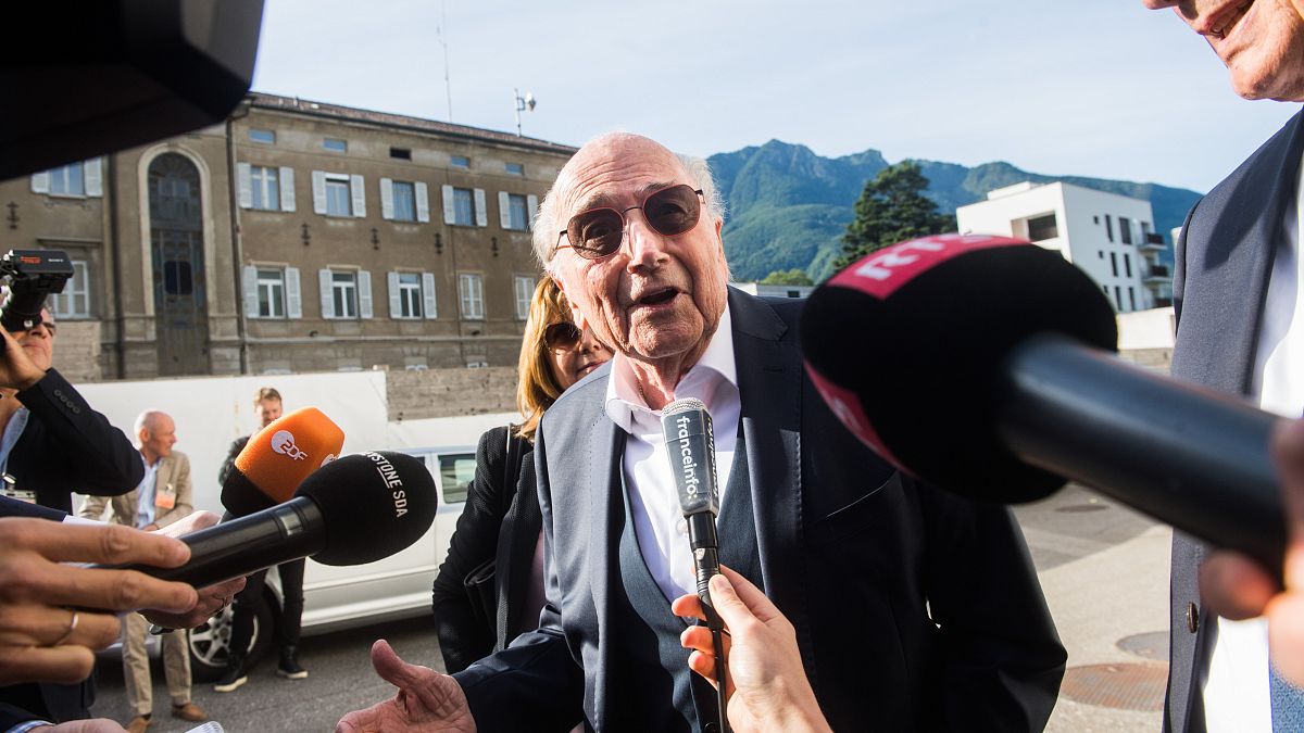 Sepp Blatter was pictured smiling as he arrived at theSwiss Federal Criminal Court in Bellinzona.