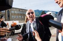 Sepp Blatter was pictured smiling as he arrived at theSwiss Federal Criminal Court in Bellinzona.