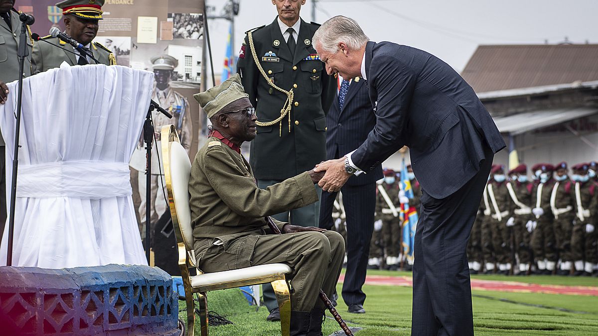 King Philippe greets 100-year-old corporal Albert Kunyuku, the last surviving Congolese veteran of World War II, in Kinshasa, Democratic Republic of the Congo, June 2022.
