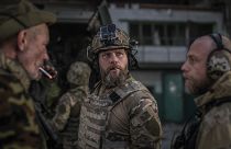 Ukrainian soldiers talk during heavy fighting at the front line in Sievierodonetsk. Wednesday, June 8, 2022.