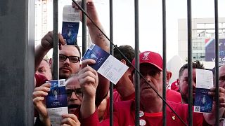 Fans shows tickets in front of the Stade de France prior the Champions League final soccer match between Liverpool and Real Madrid