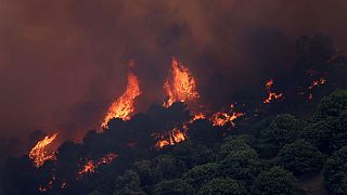 A fire rages in the hills near Pujerra, southern Spain Thursday, June 9, 2022.